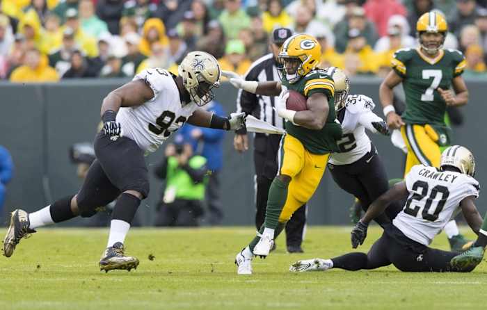 Green Bay Packers running back Aaron Jones (33) carries the ball against the New Orleans Saints. Mandatory Credit: Jeff Hanisch-USA TODAY Sports